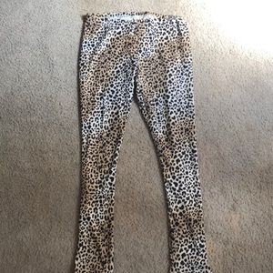 Cheetah print leggings, red shirt, black vest